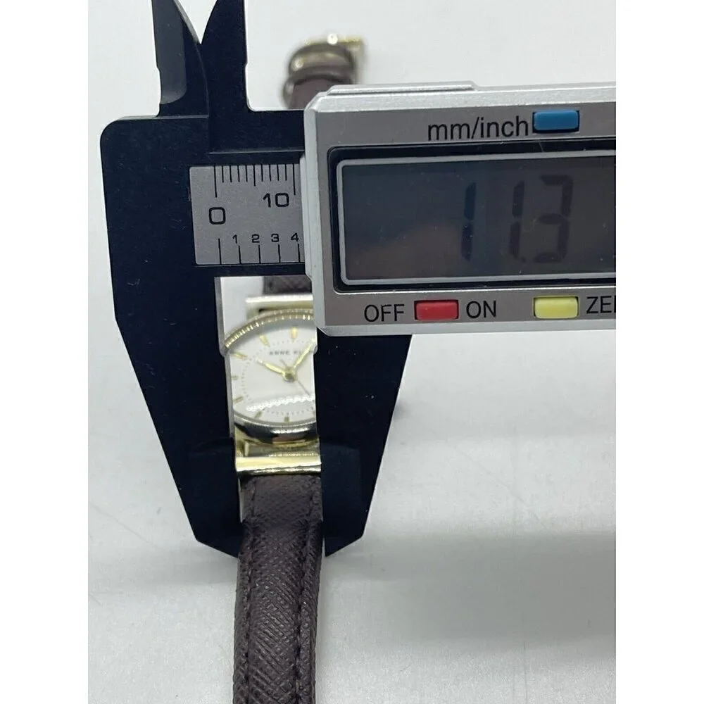 Anne Klein Women's Watch AK/2500 Round Gold Tone Case Brown Faux Leather Band